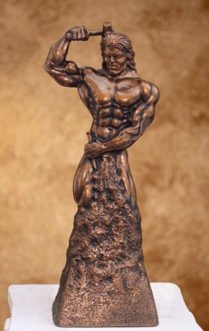 self sculpted man chiseling himself out of stone